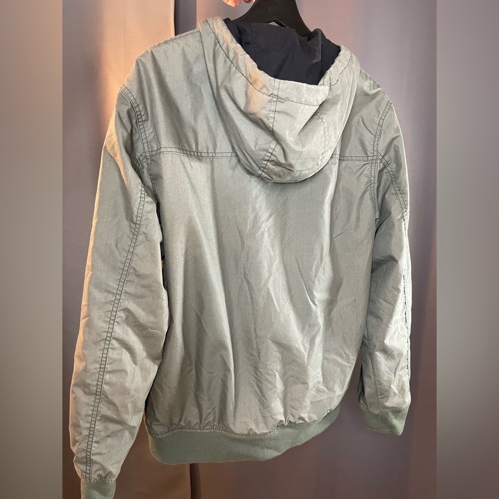 Green number jacket in size medium